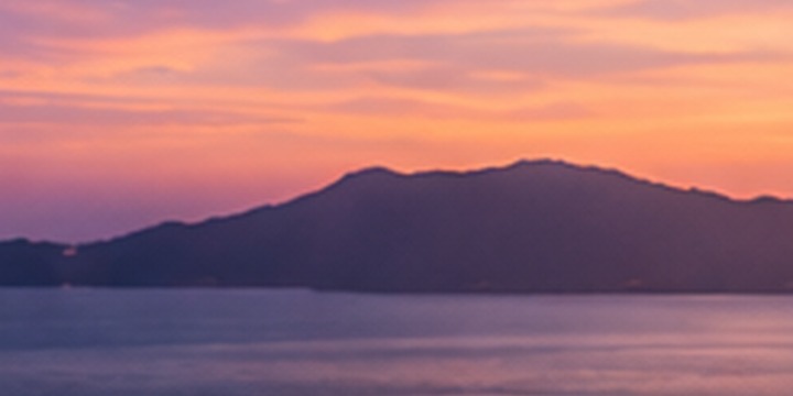 Ocean and island silhouettes at sunset